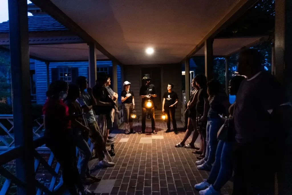 A group gathered around a tour guide